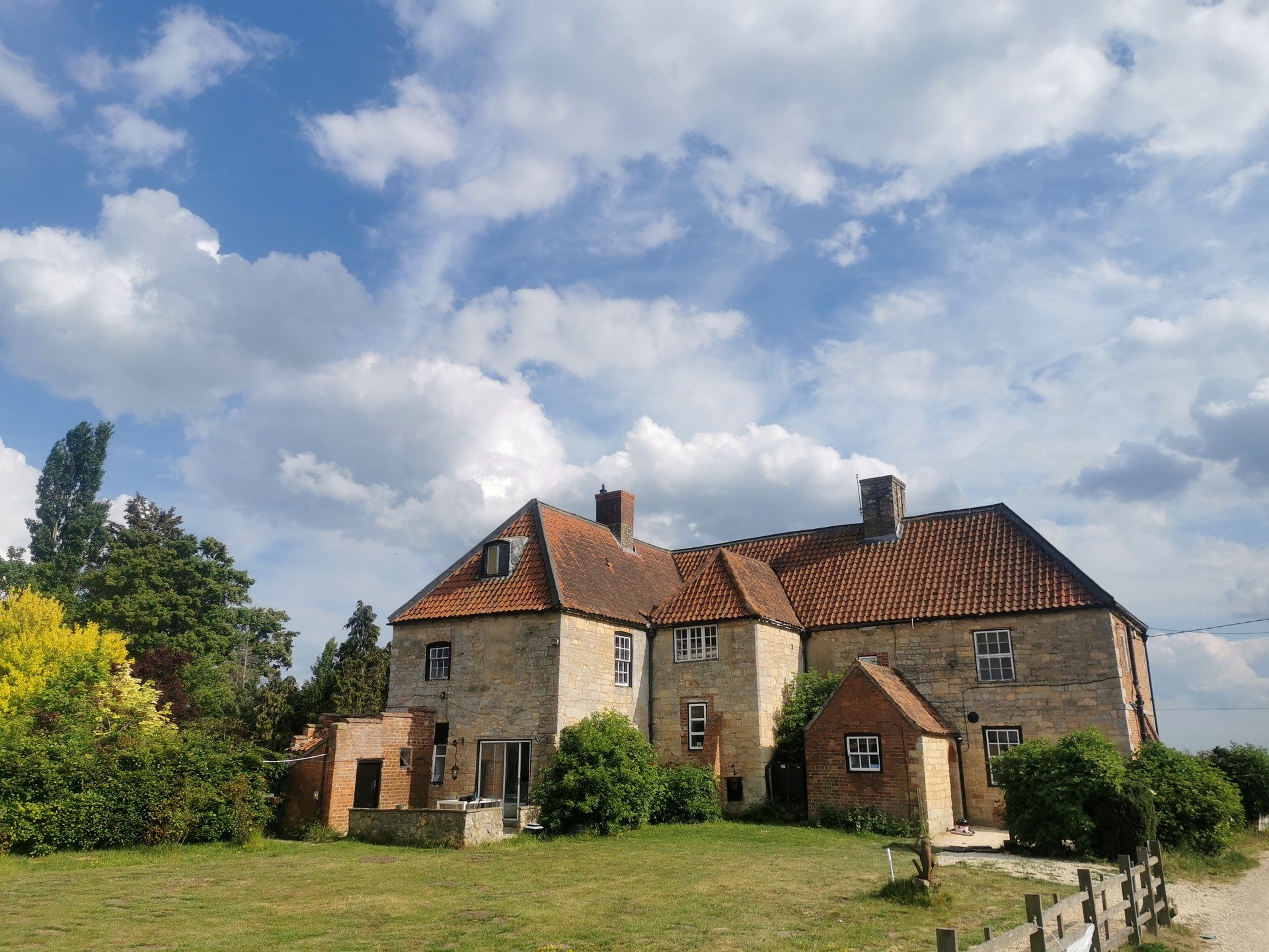Bullington Hall Farmhouse - Traditional Lincolnshire stone farm house anchoring the estate grounds